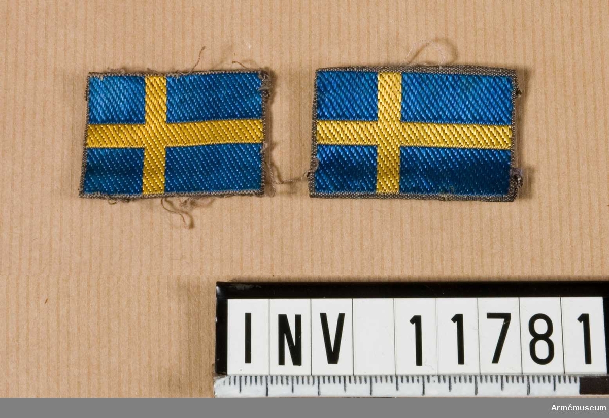 Samhörande nr är 11778 - 11783.
Grupp C I.
Nationsmärke f militär personal i utlandet. Märkt "Sweden".Gåva från kapten A de Roubetz.