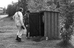 Landskap med person(er).