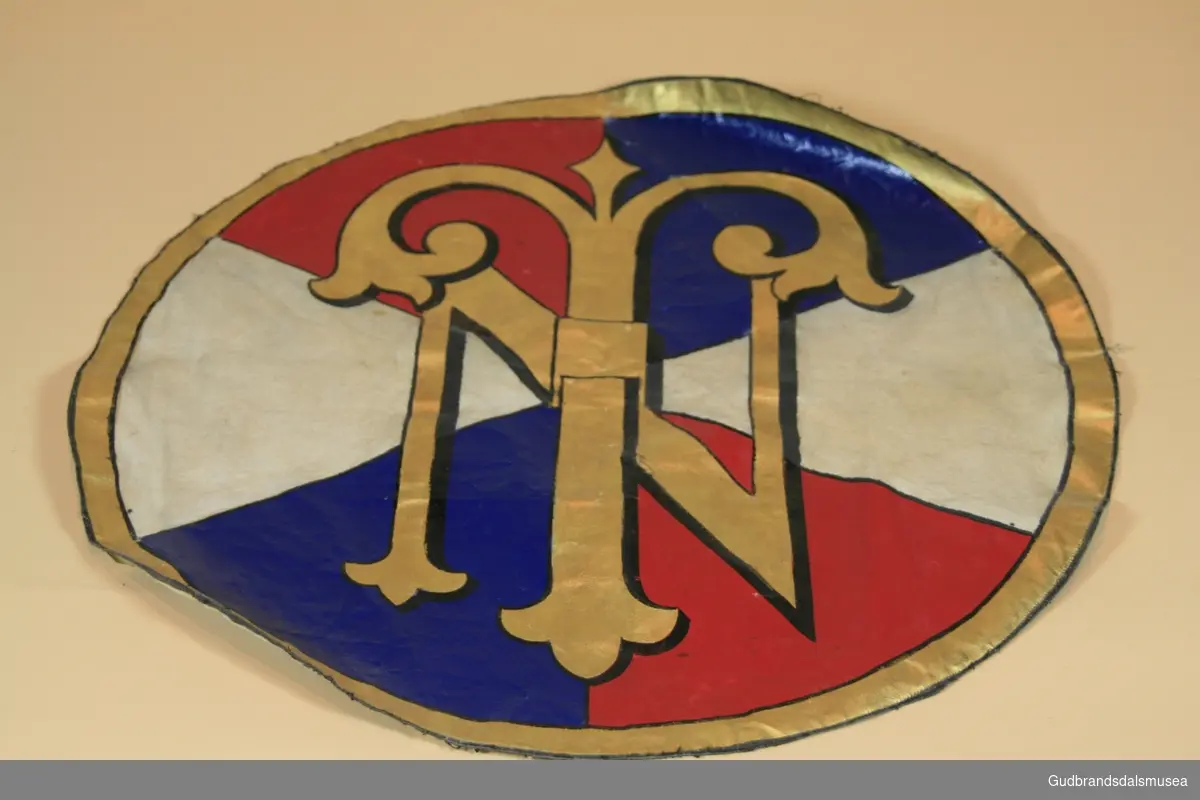 Malt emblem på lerret med logo til Den norske turistforening.