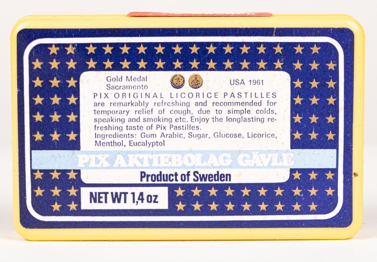 Tablettask av plast med innehåll och försegling intakt. Blå etiketter med guldstjärnor, lakrispastiller "PIX licorice pastilles".