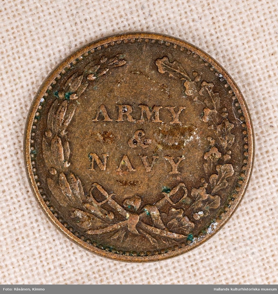 Pollett av koppar. Text: "ARMY & NAVY 1863".