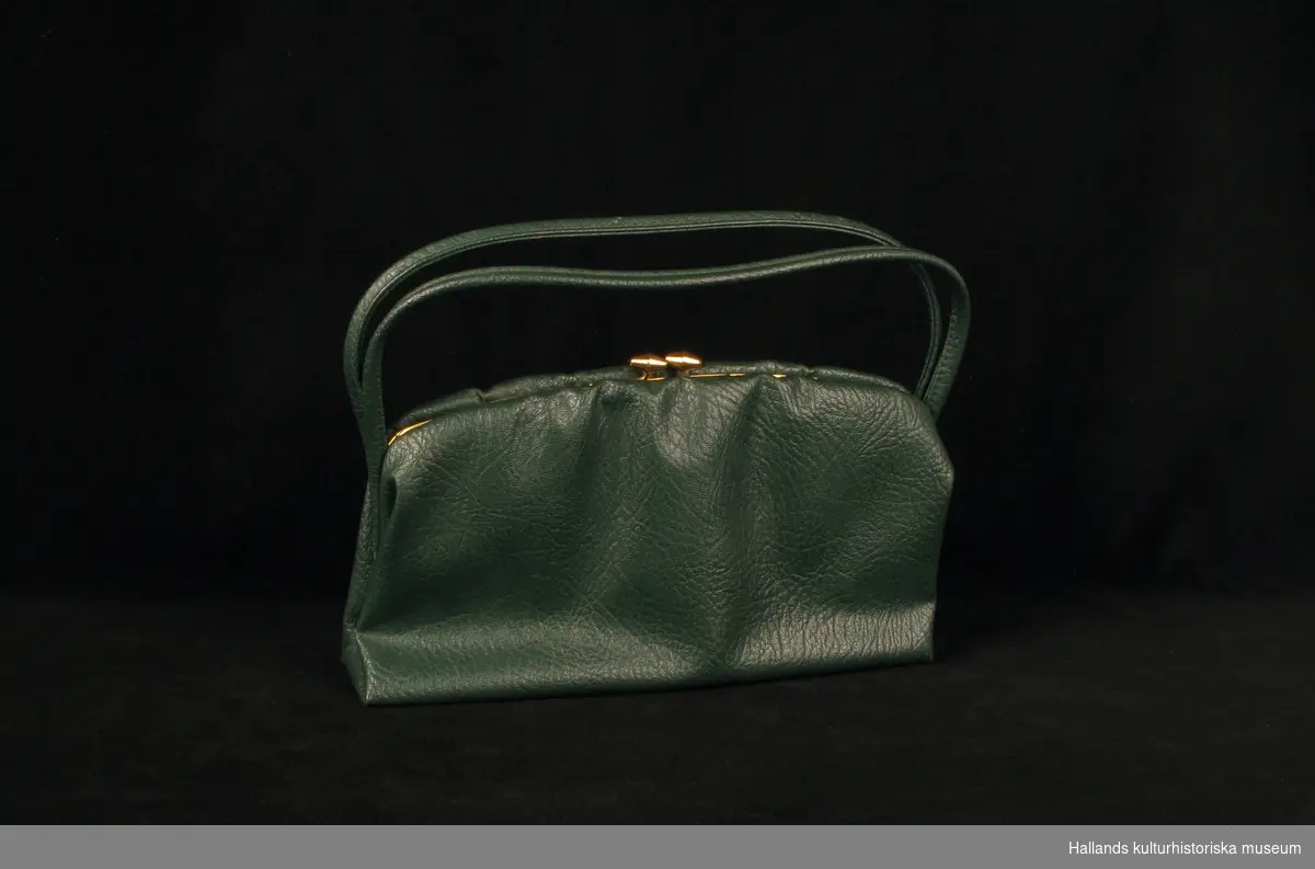 Handväska av grön plast.
