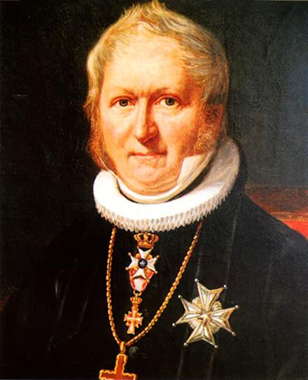 Maleriportrett av Jacob Naumann iført prestekjole, krage og medaljer.