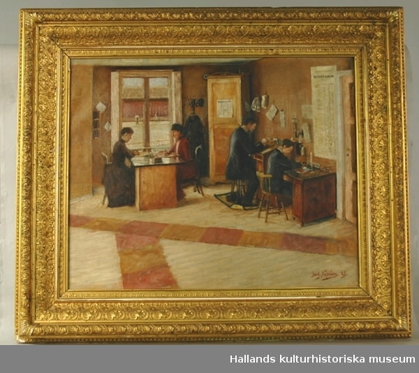 Oljemålning på duk föreställande en kontorsinteriör. Två damer och två herrar är upptagna av skrivarbete. Signerat Gust. Nordblom 89. Rikt profilerad guldmålad träram, bredd 10 cm.