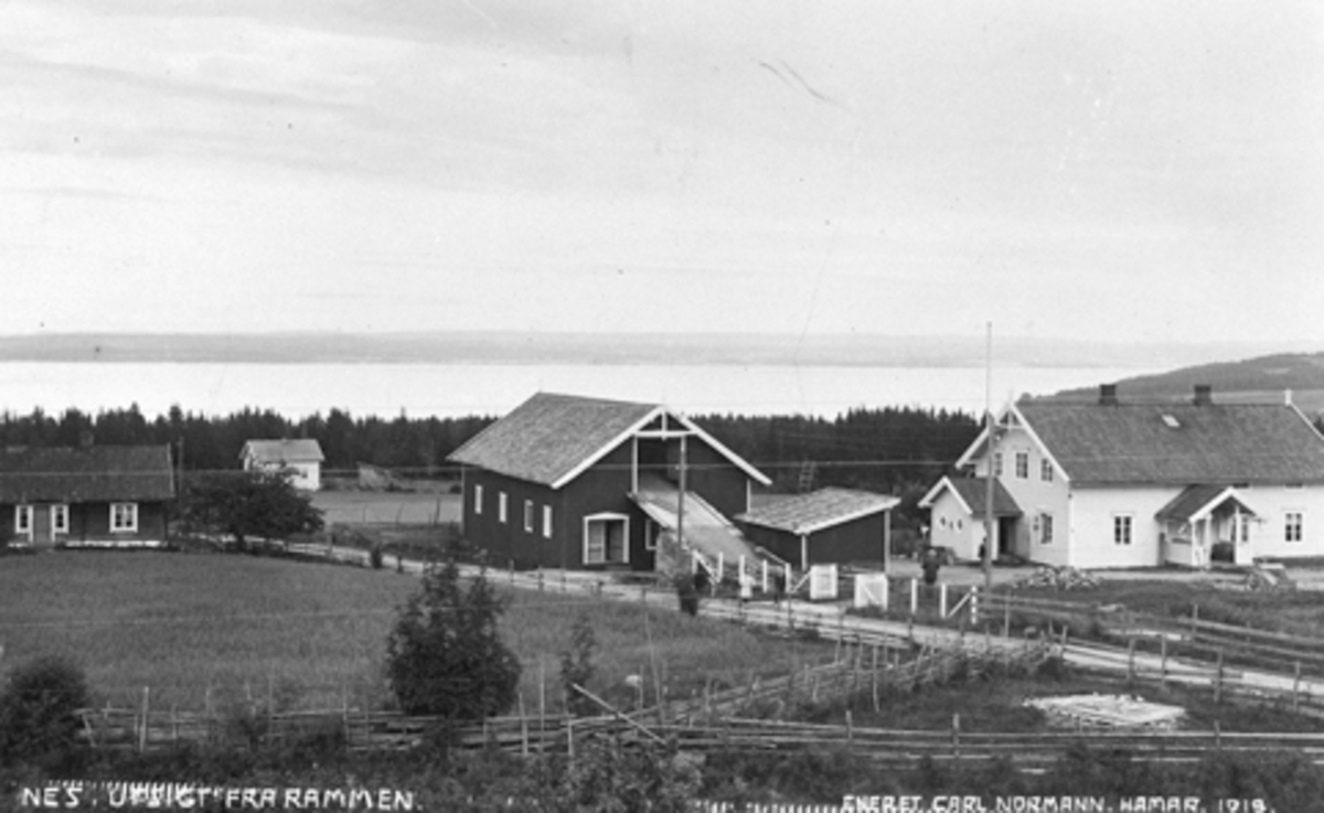 Postkort fra Nes, Hedmark med teksten "Utsigt fra Rammen". Freberg Landhandel, poståpneri  og skysstasjon.