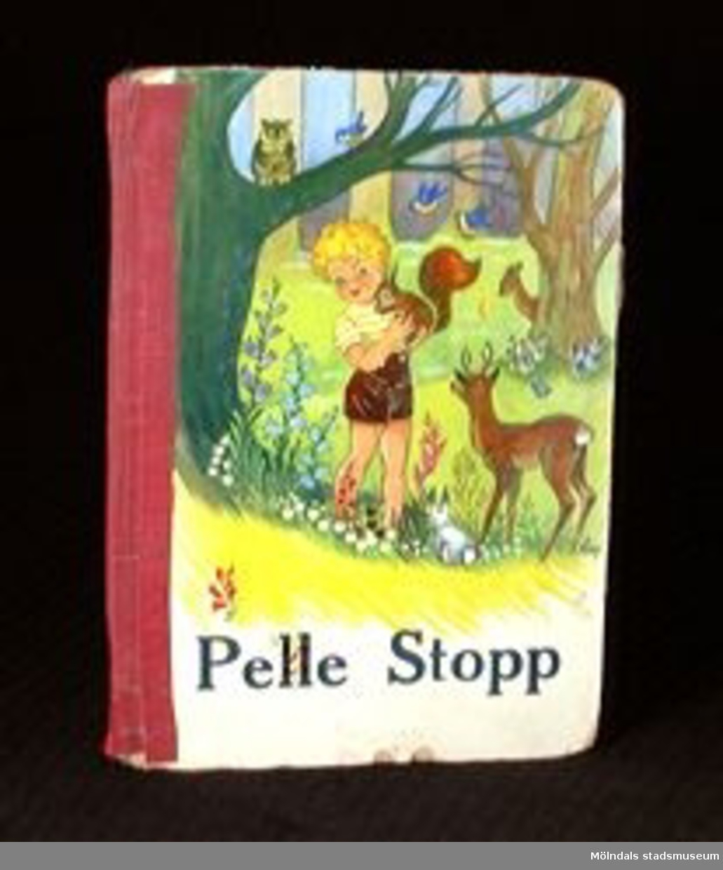 Titel: "Pelle Stopp". Text: Edna Christenssn Illustrationer: Aina Johansson.Utgiven av förlaget Kärnan AB i Helsingborg.