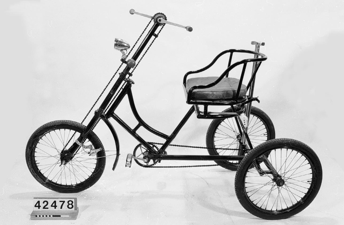 Trehjulig handikappcykel.
