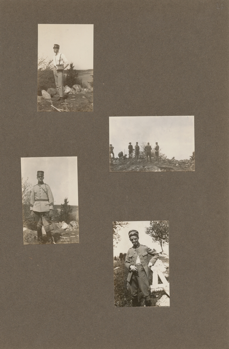 En soldat från Södermanlands regemente med uppknäppt jacka och cigarett i munnen på en kulle.