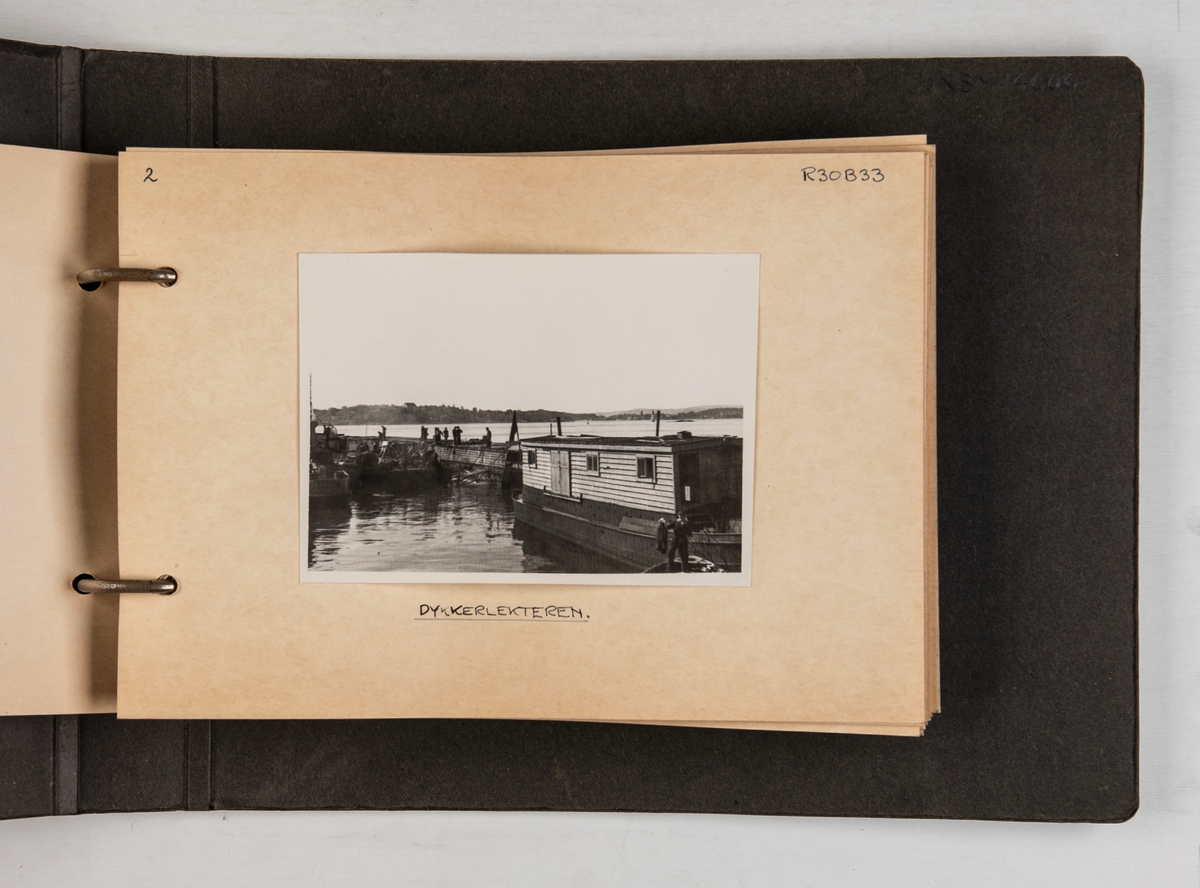 Album med fotografier fra hevingen og opprettingen av M/S 'Troma' i 1946.