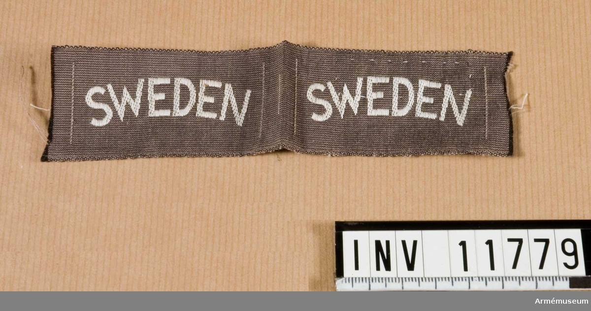 Samhörande nr är 11778 - 11783.
Grupp C I.
Nationsmärke f militär personal i utlandet. Märkt "Sweden".Gåva från kapten A de Roubetz.