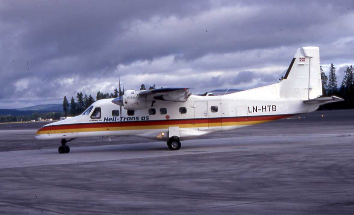 Ett fly på bakken , Dornier 228-110 LN-HTB, fra Heli-Trans.