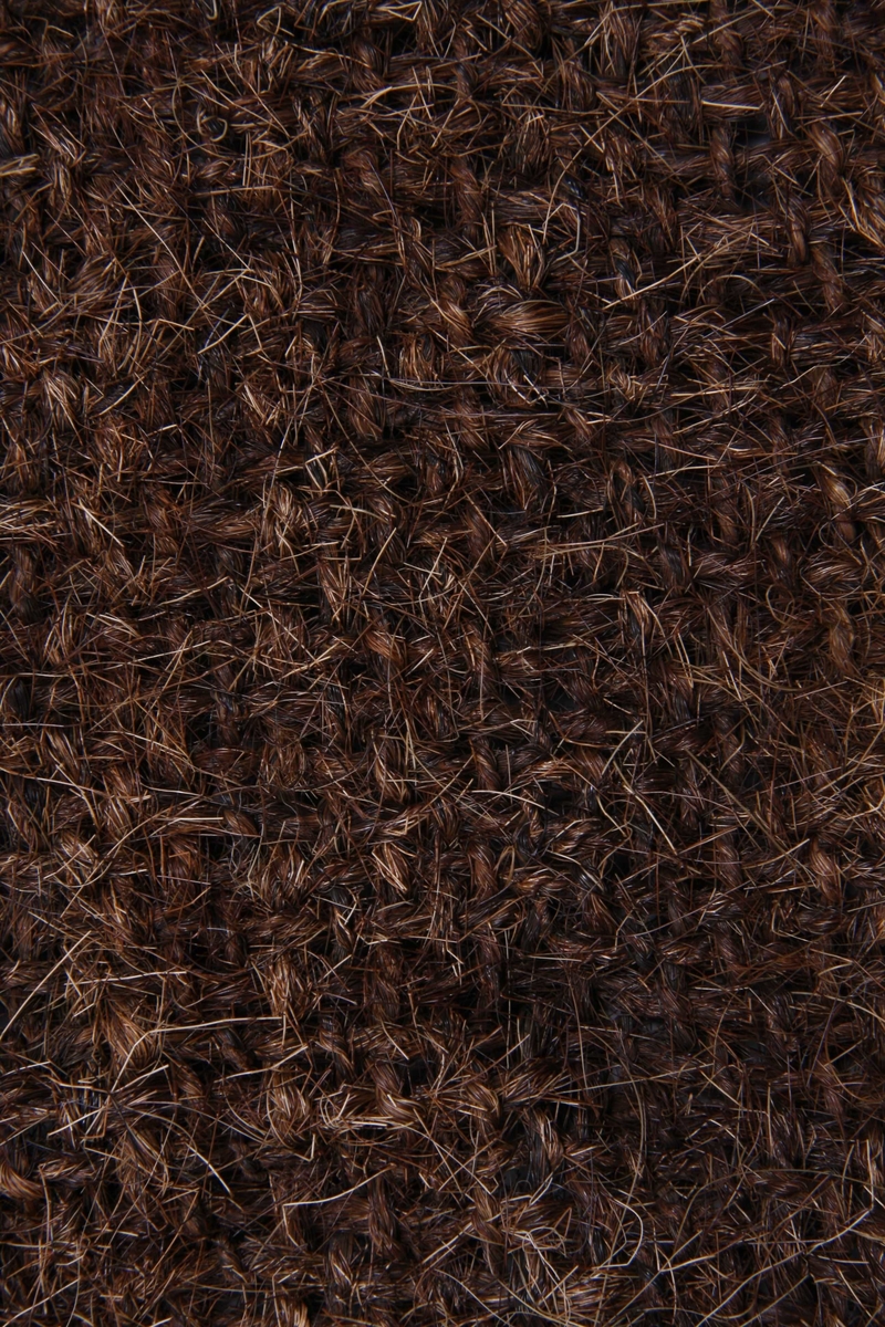 Rektangulær silduk laga av hår frå kuhalar, spunne og tvinna til tjukke trådar og vevd til duk. Duken vert brukt til å tørke malt til ølbrygging.