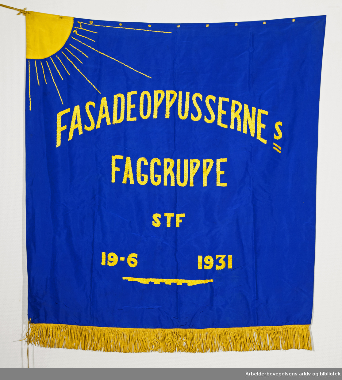 Fasadeoppussernes Faggruppe (Forside). Fanetekst: Fasadeoppussernes Faggruppe STF 19. 6. 1931