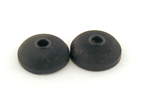 Två stycken knappar av plastmassa.

Enligt liggaren: knappar, 11 stycken, svarta, av horn och metall.