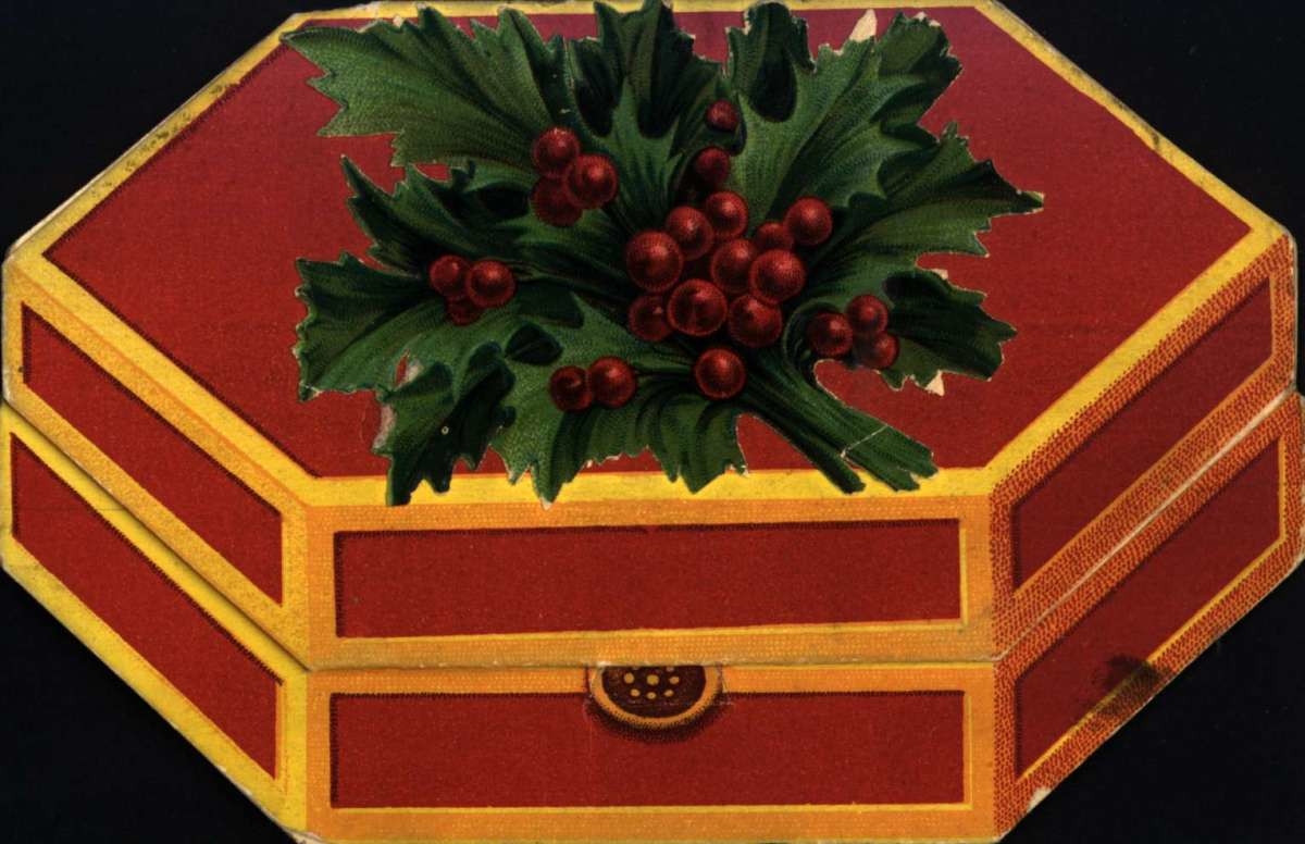 Julekort, Jule og nyttårshilsen. Eske med kristtornbukett
på toppen. Inne i esken en engel. Poststemplet 3.12.1931.