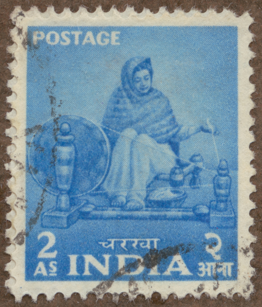 Frimärke ur Gösta Bodmans filatelistiska motivsamling, påbörjad 1950.
Frimärke från Indien, 1955. Motiv av "Naga" kvinna, spinnande för hand med slända.