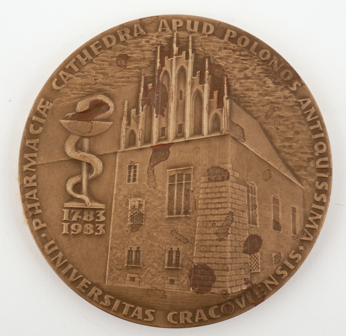 Medalje med bilde av Jan Szaster på forsiden og universitetet i Krakow(?) på baksiden.